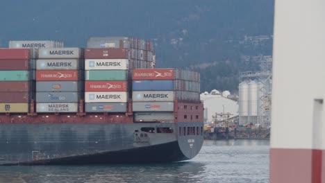 Freighter-Ship-Fully-Loaded-With-Container-Vans-Sailing-In-Brockton-Point,-Stanley-Park-In-Vancouver,-Canada---Closeup-Shot