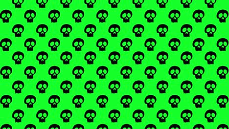 Animación-De-Fondo-De-Halloween-Pequeñas-Calaveras-Negras-Moviéndose-Hacia-Arriba-Sobre-Fondo-Verde