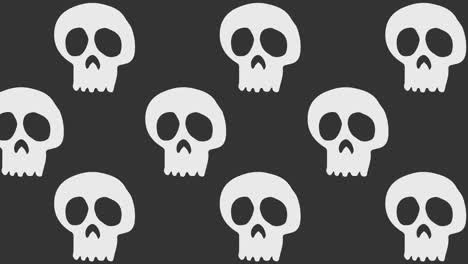 Animación-De-Fondo-De-Halloween-Grandes-Calaveras-Blancas-Neutras-Moviéndose-Hacia-La-Izquierda-Sobre-Fondo-Gris