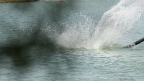 Slow-motion-shot-male-Flyboarder-Flying-over-sea-and-diving-into-water-during-holiday