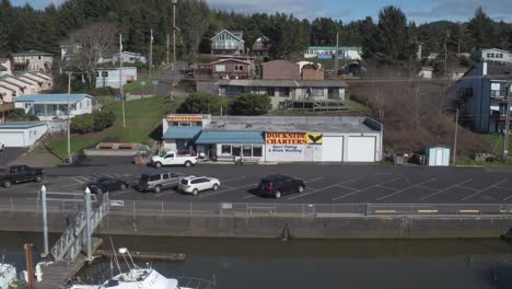 Aerial-of-Boats-docked-in-Depoe-Bay,-the-worlds-smallest-Harbor