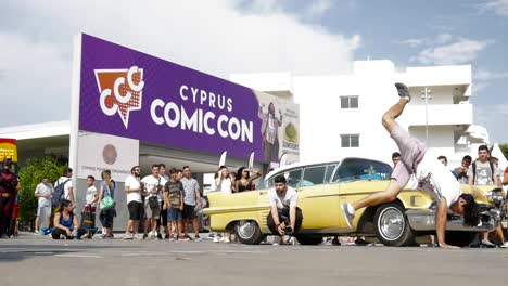 A-break-dancer-performs-outside-at-the-entrance-to-the-Cyprus-Comic-Con-in-Nicosia,-Cyprus