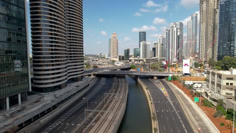 Aerial-view-of-the-Ayalon-River-and-the-quiet-Tel-Aviv,-Israel---reverse,-drone-shot