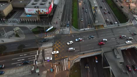 4k-Aerial-Footage-Bird's-Eye-View-over-the-crowded-Carnaval-y-Moreyra-Bus-Station-on-the-Via-Expressa-in-Lima-Peru,-capital-city