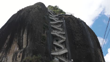 Steep-stairs-climb-the-towering-El-Peñón-de-Guatapé-rock-formation-in-Colombia