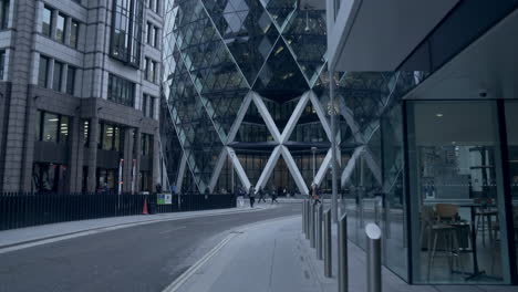 Travelling-and-slow-tilt-up-shot-of-the-St-Mary-Axe-building-in-London