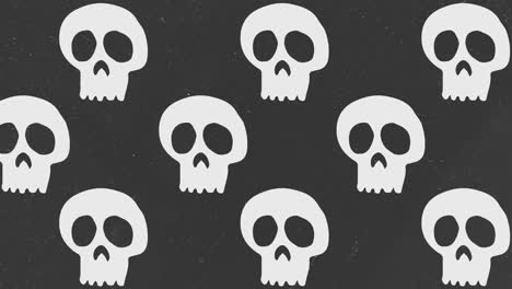 Halloween-Background-animation-large-neutral-white-skulls-moving-to-the-left-over-gray-background-with-grain