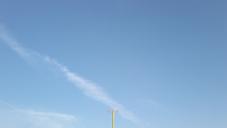 Tilting-Down-Shot-Revealing-Approach-Lighting-System-at-Leeds-Bradford-International-Airport-in-Yorkshire,-England-on-Sunny-Morning