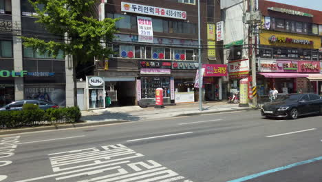 Shot-of-street-from-moving-bus-in-Seoul,-South-Korea