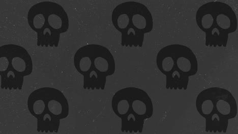 Animación-De-Fondo-De-Halloween-Grandes-Calaveras-Negras-Neutrales-Moviéndose-Hacia-La-Izquierda-Sobre-Fondo-Gris