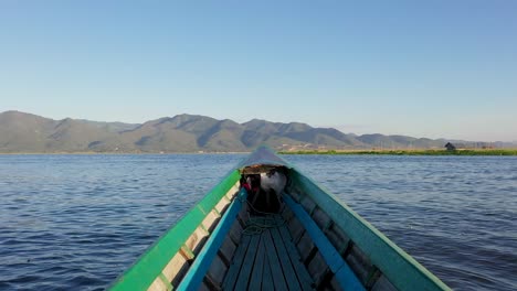 Longtail-boats-with-tourists-crossing-over-the-water