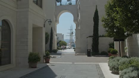 People-passing-by-through-a-shopping-street-in-Porto-Montenegro