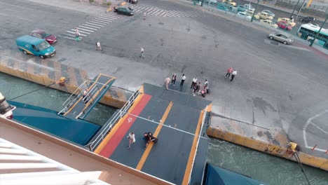 Tourists-boarding-on-a-commercial-ship-in-Piraeus-port-during-summer
