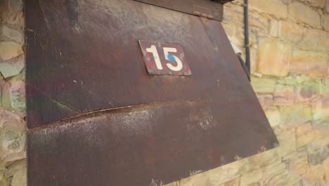 An-open-electrical-meter-box-mounted-on-a-stone-wall-in-Lefkara,-Cyprus