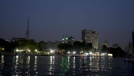 View-from-a-sailboat-on-the-Nile-River-in-Cairo,-Egypt-at-nighttime