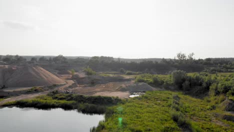 Aerial-dolly-shot-from-a-drone-of-quarry-and-heavy-machinery-in-pomeranian-district-in-Poland