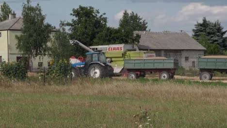 The-tractor-pulls-loaded-trailers-with-fresh-grain