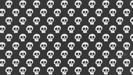 Animación-De-Fondo-De-Halloween-Pequeñas-Calaveras-Blancas-Moviéndose-Hacia-La-Izquierda-Sobre-Fondo-Negro-Con-Grano