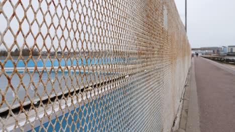 Rusty-fence-surrounding-lido