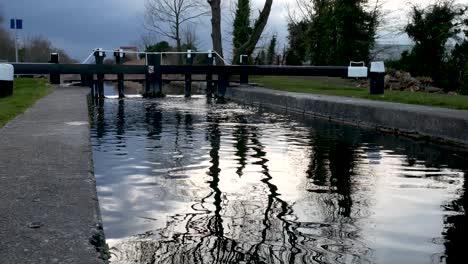 Old-sluice-gate-water-flowing-through-,-Grand-canal-,Dublin-Ireland