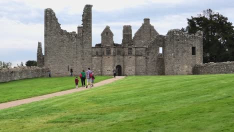 Tourists-walking-up-path-to-Tolquhon-Castle