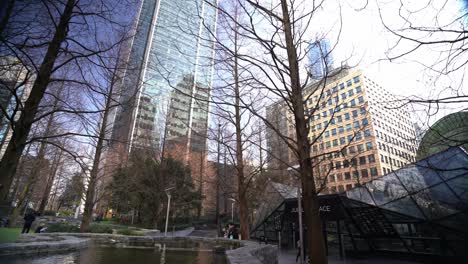 Walking-through-Jubilee-Park-on-spring-day-looking-up-at-the-tall-skyskrapers