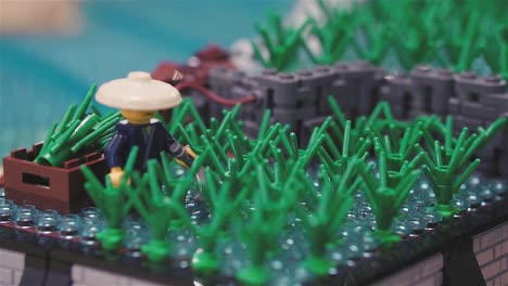 LEGO-build-of-a-farmer-taking-care-of-his-weeds-|-SLOWMOTION