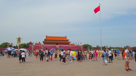 Large-crowd-of-people-in-Tiananmen-Square,-Beijing-China---Gate-of-Heavenly-Peace,-its-one-of-the-largest-public-squares-in-the-world