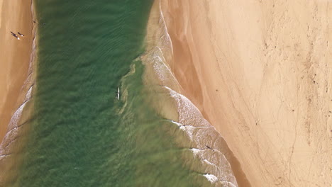 Racing-kayak-fighting-current-at-estuarine-river-mouth-of-Still-Bay