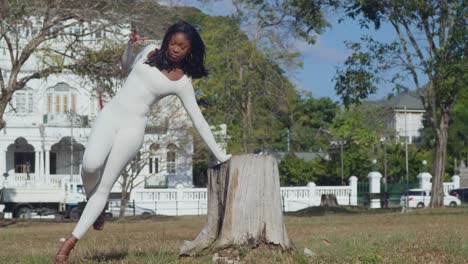 Wearing-a-white-bodysuit,-a-young-girl-enjoys-a-city-day-with-castles-in-the-background