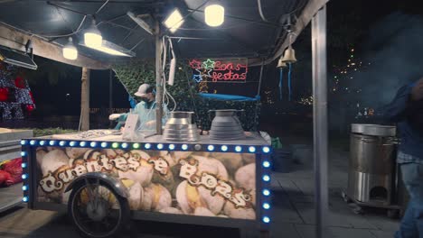 Chestnut-vender-smoking-fresh-batch-on-boulevard-near-Funchal-Harbor-at-night