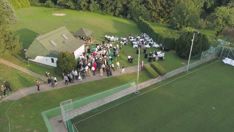 Aerial-view-of-a-wedding-celebration-in-a-tennis-club