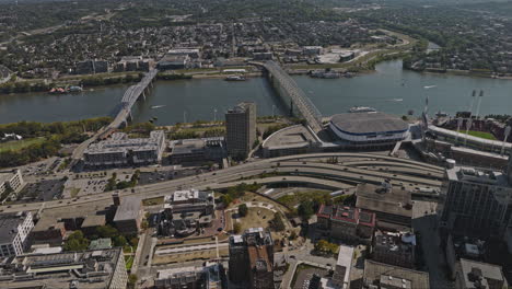 Cincinnati-Ohio-Aerial-v12-flyover-Queen-city-square-capturing-downtown-cityscape-of-central-business-district,-freeway-traffics-and-river-crossing-bridges---Shot-with-Inspire-3-8k---September-2023