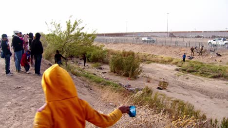 Divided-Dreams:-Migrants-at-US-Mexico-Border-Wall