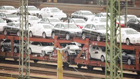 New-cars-transported-on-a-freight-train-at-a-railyard