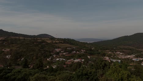 Aerial-drone-shot-in-mexico-michoacan,-in-town-call-Cheran,-green-woods-in-background