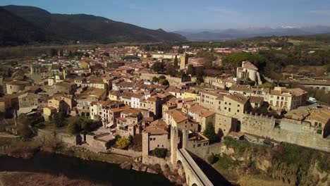 Historic-town-of-Besalu-in-Girona,-Spain-captured-from-above,-showcasing-its-medieval-architecture