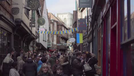 A-lot-of-people-in-busy-York-street-under-the-Ukraine-flag