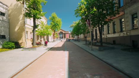 Footage-of-traveling-through-Daugavpils-main-street,-Riga-iela,-with-the-train-station-in-the-background