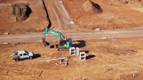 Aerial-view-of-tracked-excavator-in-a-residential-construction-zone