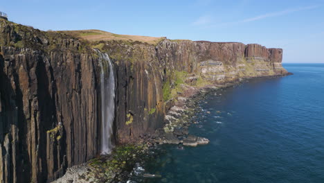 Aerial-approaching-Mealt-waterfall-and-Kilt-Rock,-Isle-of-Skye,-Scotland