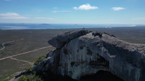 Slow-Motion-Shot-Of-Tourists-On-Frenchman-Mountain-in-Cape-Le-Grand-Area-Exploring-Stunning-Landscape