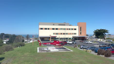 Medical-Transport-and-Rescue-Helicopter-taking-off-from-Gold-Beach-Hospital,-Oregon