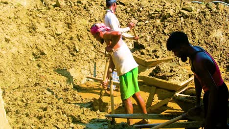 Laborers-Hard-Workers-Digging-Muddy-Soil-For-brick-making-at-the-Sunlight