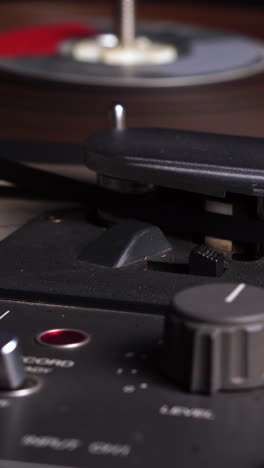 Vertical-4k,-Vintage-Professional-Magnetofon-and-Spinning-Reel-to-Reel-Tape,-Close-Up