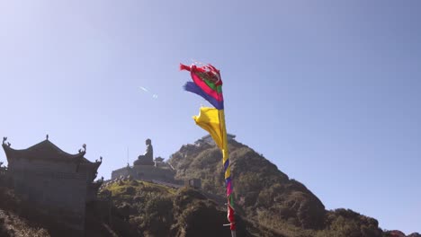 prayer-flags-flapping-in-the-wind-on-Fansipan,-the-highest-mountain-in-Indochina-located-in-Sapa,-Vietnam