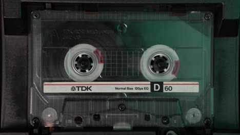 Placing-and-Starting-Cassette-Tape-With-Audio-Recording-in-Vintage-Deck-Player,-Close-Up