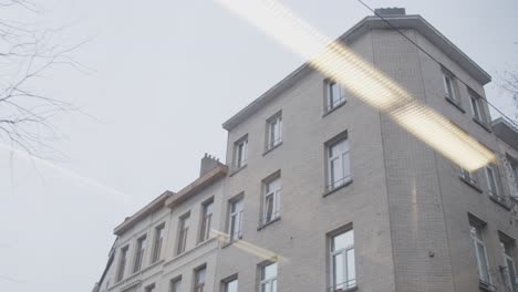 Dynamic-shot-of-building-through-tramwindow