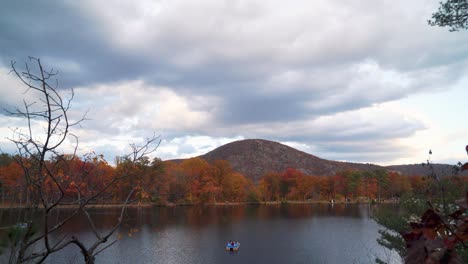 Beautiful-Time-Lapse-Of-People-Pedal-Boating-On-A-Lake-In-Autumn-Colors