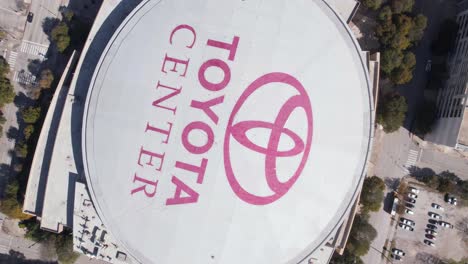 Houston-TX-USA,-Top-Down-Aerial-View-of-Toyota-Center-Arena-Rooftop-and-Logo,-High-Angle-Drone-Shot